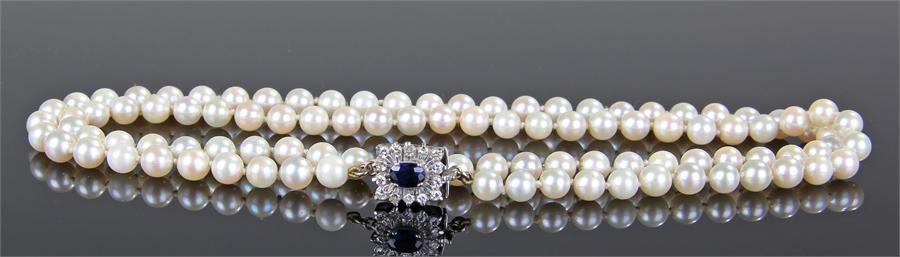 Pearl sapphire and diamond set necklace, the row of pearls with a sapphire and diamond set clasp,