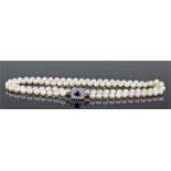 Pearl sapphire and diamond set necklace, the row of pearls with a sapphire and diamond set clasp,