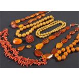 Collection of Bakelite amber, with necklaces and brooches, together with a coral necklace, (qty)