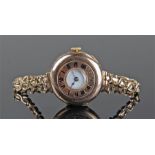 9 carat gold ladies wristwatch, the half hunter case with outer chapter ring, interior white dial,