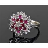 18 carat gold white gold, diamond and ruby set ring, flower head design with twenty six diamonds and