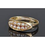 18 carat gold pearl and ruby set ring, with two rows of pearls and central row of rubies, ring