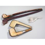 19th Century cased Churchwarden meerschaum clay pipe, 46cm long together with another meerschaum