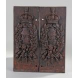 Pair of Victorian iron plaques, with a central VR with crown above, leaf and flower boarder, B ^ O