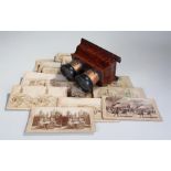 19th Century stereoscopic viewer, the amboyna case with lenses to the top, together with a