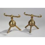 Pair of late 19th Century brass fire dog in the manner of Christopher Dresser, the spherical body