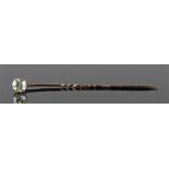 Single diamond set stick pin, the single diamond at approximately 0.80 carat, raised on a gold pin