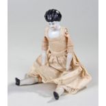 Victorian porcelain doll, with a porcelain head, original clothing and bisque porcelain hands and