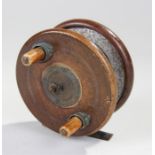 Early 20th Century fishing reel, the mahogany frame with bronze mounts, 10cm diameter