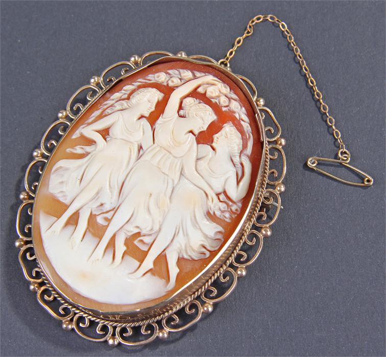 9 carat gold mounted cameo brooch, the cameo carved with three dancing maidens, housed within a 9 - Image 2 of 2