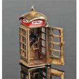 9 carat gold novelty phone box, the charm with a hinged door enclosing a telephone, 8 grams