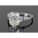 Fine Art Deco period diamond set ring, with central emerald cut approximately 4 carats, the shank