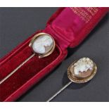 Two Victroian stick pins, the first of a classical man facing left, the second cased example with