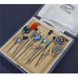 Collection of stick pins, to include a Victorian silver example, stone set examples, animals,