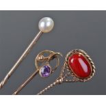 Four stick pins, to include an example with a pearl set to the top, a 15 carat gold amethyst set