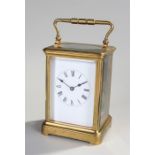 Early 20th Century French gilt brass carriage clock, the corniche case with five bevelled glass