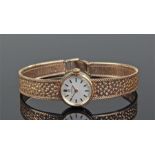 Omega ladies 9 carat gold wristwatch, the silvered dial with gilt baton hour makers, 9 carat gold