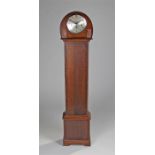 Early 20th Century oak longcase clock, of small proportions, the arched top above a long trunk and