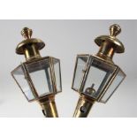 19th Century pair of brass lamps, the turned finial top above a six glass lamp and tapering body,