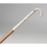 Slender 19th Century bone carved walking cane, the