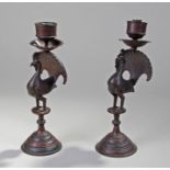 Pair of Indian peacock candlesticks, each with a c