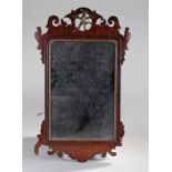 George III mahogany fret wall mirror, with central