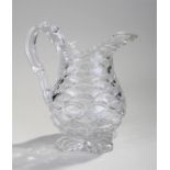 Early 19th Century glass water jug, in the form of