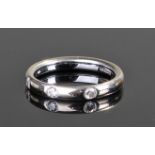 18 carat white gold and diamond set wedding band,