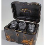 Rare 18th Century black lacquered and glass inset tea caddy, the serpentine case with gilt decorated