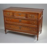 Early 19th Century French walnut commode, the rectangular top with rounded corners above three short