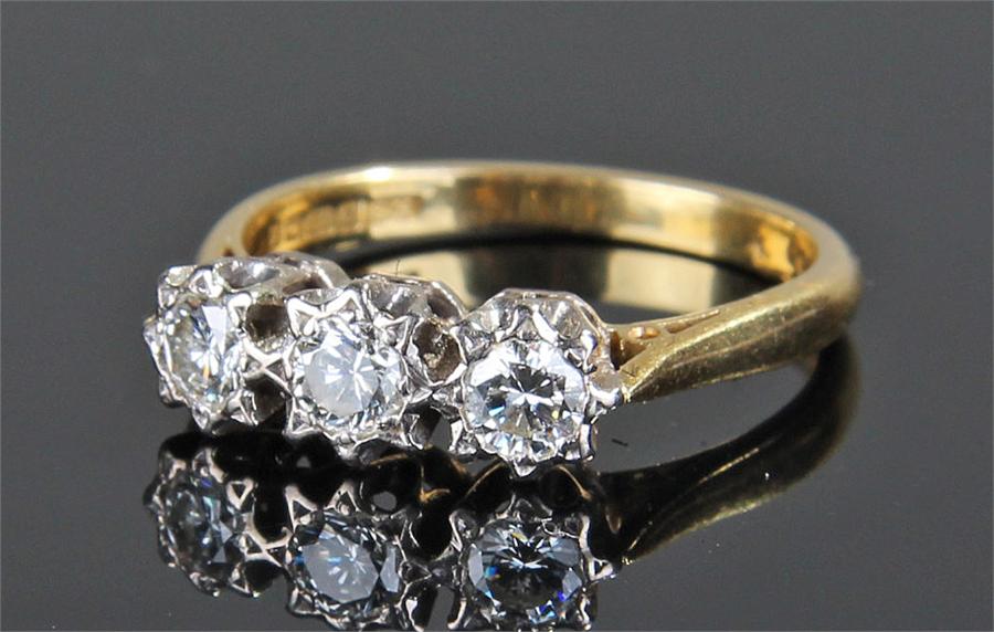 18 carat gold diamond set ring, the platinum mount