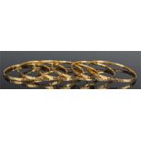 Set of six Middle Eastern gold bracelets, with fis