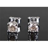 Pair of 18 carat white gold diamond set earrings,