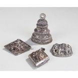 Indian white metal, to include two brooches, a wei
