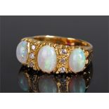 18 carat gold opal and diamond ring, with three op