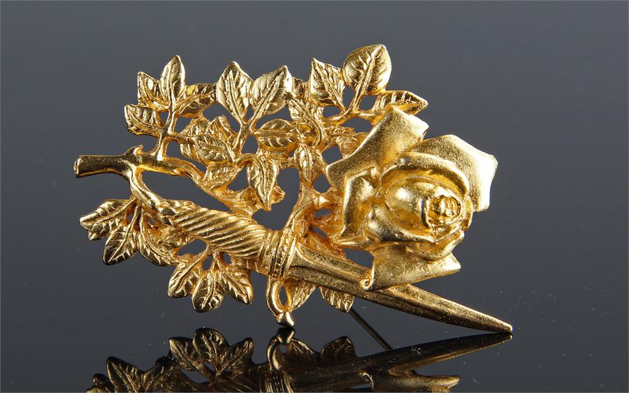 Gilt metal brooch by Rene Magritte, the rose head