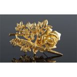 Gilt metal brooch by Rene Magritte, the rose head