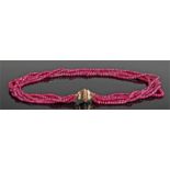 Six strand faceted ruby necklace, with a 14 carat