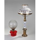 Two Victorian oil lamps, the first with a milk gla