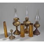 Three Victorian oil lamps, each in brass, together