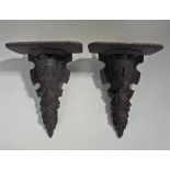 Pair of carved pine brackets, each with a rectangu