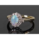 18 carat gold diamond and opal ring, with a centra