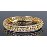 18 carat gold fancy diamond bangle, set with appro