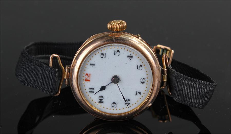 9 carat gold ladies wristwatch, with a white enamel dial, case size 26mm diameter