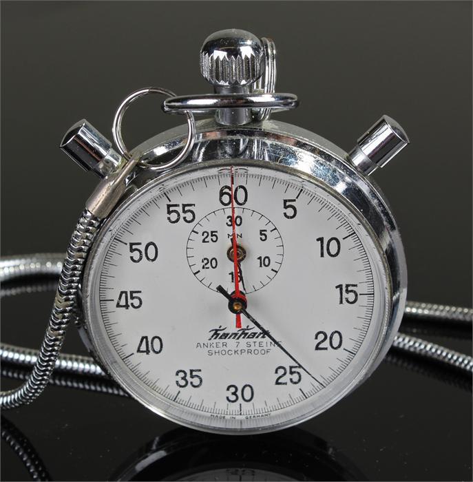 Hanhart chrome stopwatch, with a white dial, Arabic hours, together with a watch chain, (2)