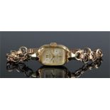 Eppo ladies 14 carat gold wristwatch, the signed champagne dial, dot hours, 9 carat gold strap