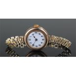 Ladies 9 carat gold wristwatch, the white enamel dial with Arabic hours, rolled gold strap, case