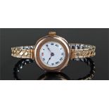 9 carat gold ladies wristwatch, with a white enamel dial, gold plated elasticated strap, case 26mm