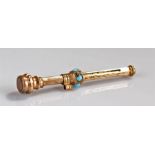 A small gold-plated propelling pencil with engraved body and glass stone end and turquoise stones to