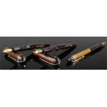 Two Eversharp Fountain Pens with Brown and Black Striped effect both with 14 carat gold nibs,